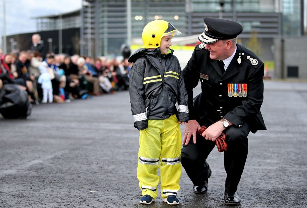 Chief Officer Alasdair Hay meets Aiden Clarke, aged 7, who watched his firefighter uncle Dominic Green graduate in a special ceremony (Jane Barlow/PA Wire)