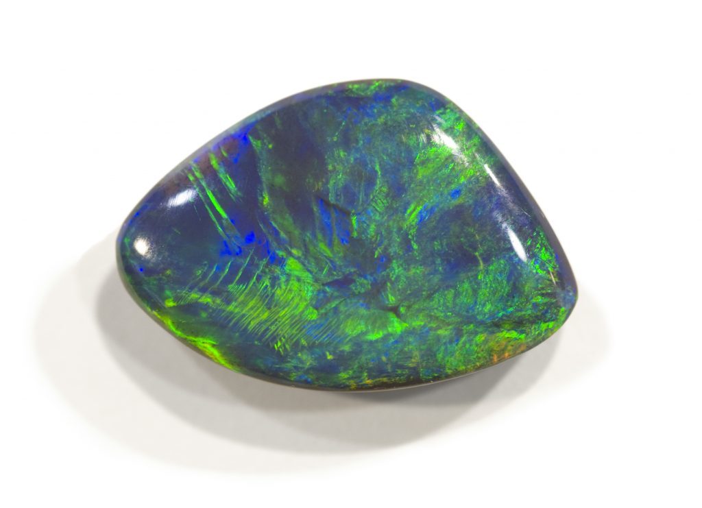Polished opal from Lightning ridge, Australia. 2cm across.