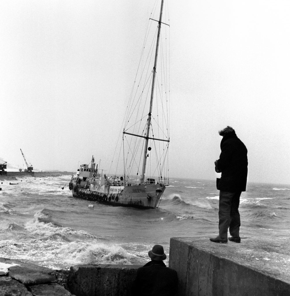 The "pirate" radio ship Radio Caroline aground in rough water, 1966 (PA Archive)