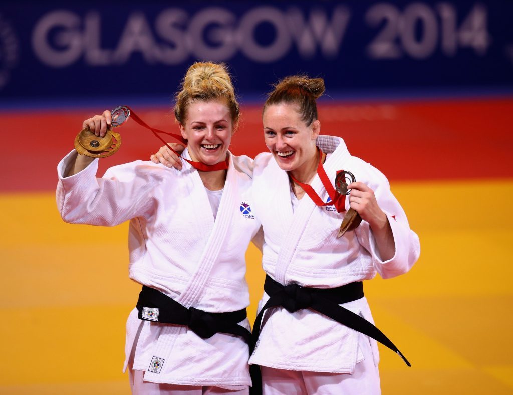 Stephanie (left) and Connie Ramsay picking up medals at Glasgow 2014 (Richard Heathcote/Getty Images)