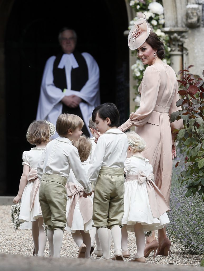 Catherine, Duchess of Cambridge, right, arrives with the pageboys and flower girls (Kirsty Wigglesworth - Pool/Getty Images)