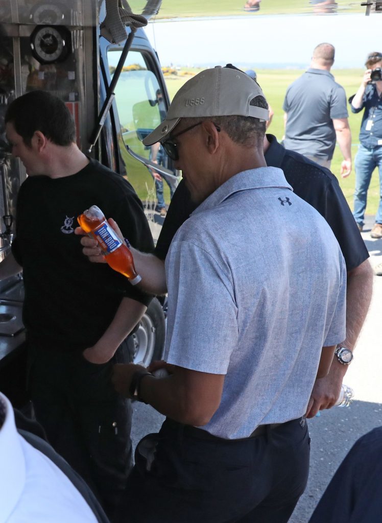 Sir Tom Hunter presents a bottle of Irn-Bru to Obama (Andrew Milligan/PA Wire)