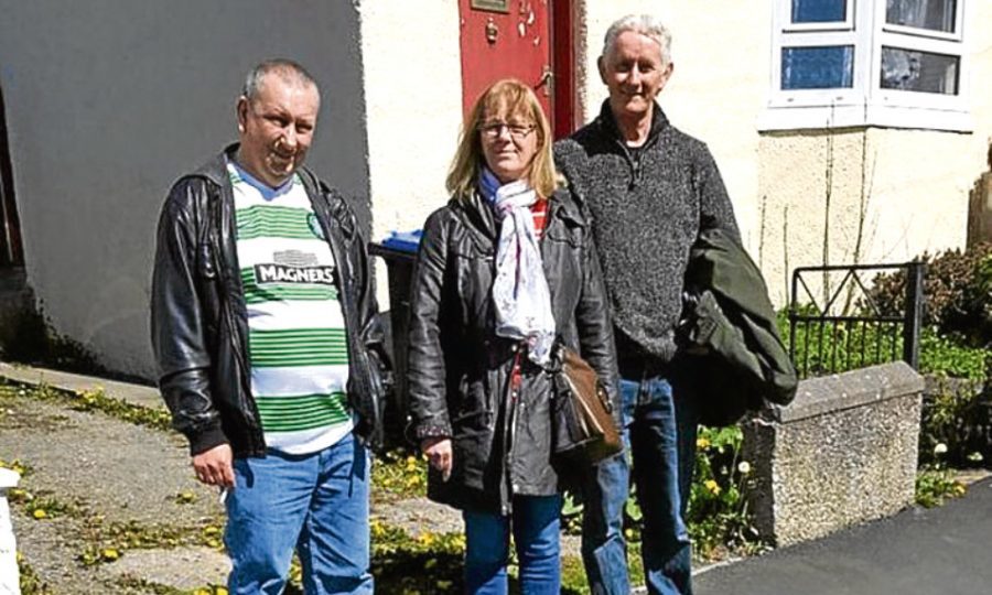 Tommy Chalmers, Pat McBain and Robert Weston, Right, outside the house in Turrif where their family lived