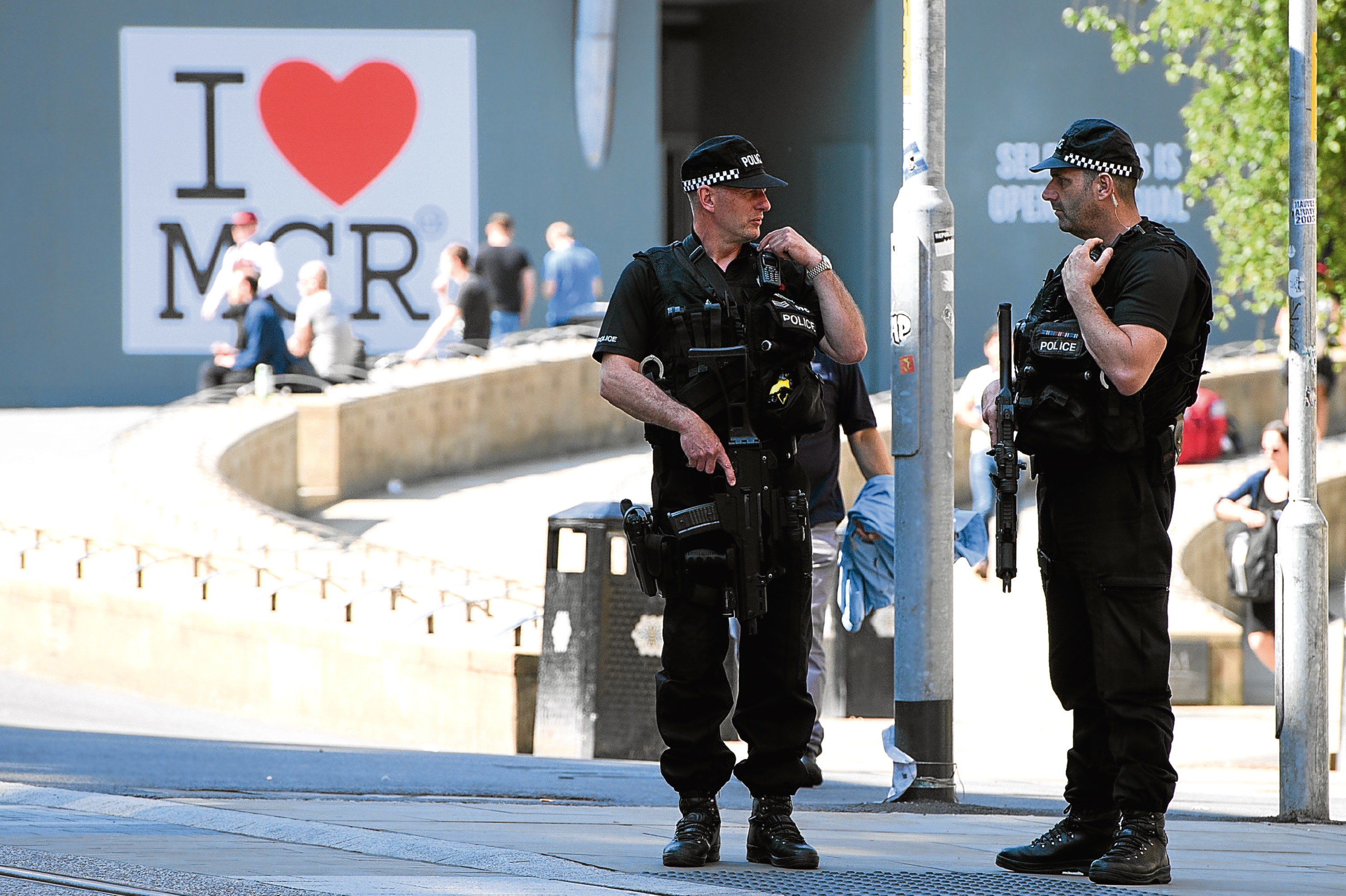 Armed police patrol the city centre ahead of a national minute's silence in remembrance of all those who lost their lives in the Manchester Arena attack (Leon Neal/Getty Images)