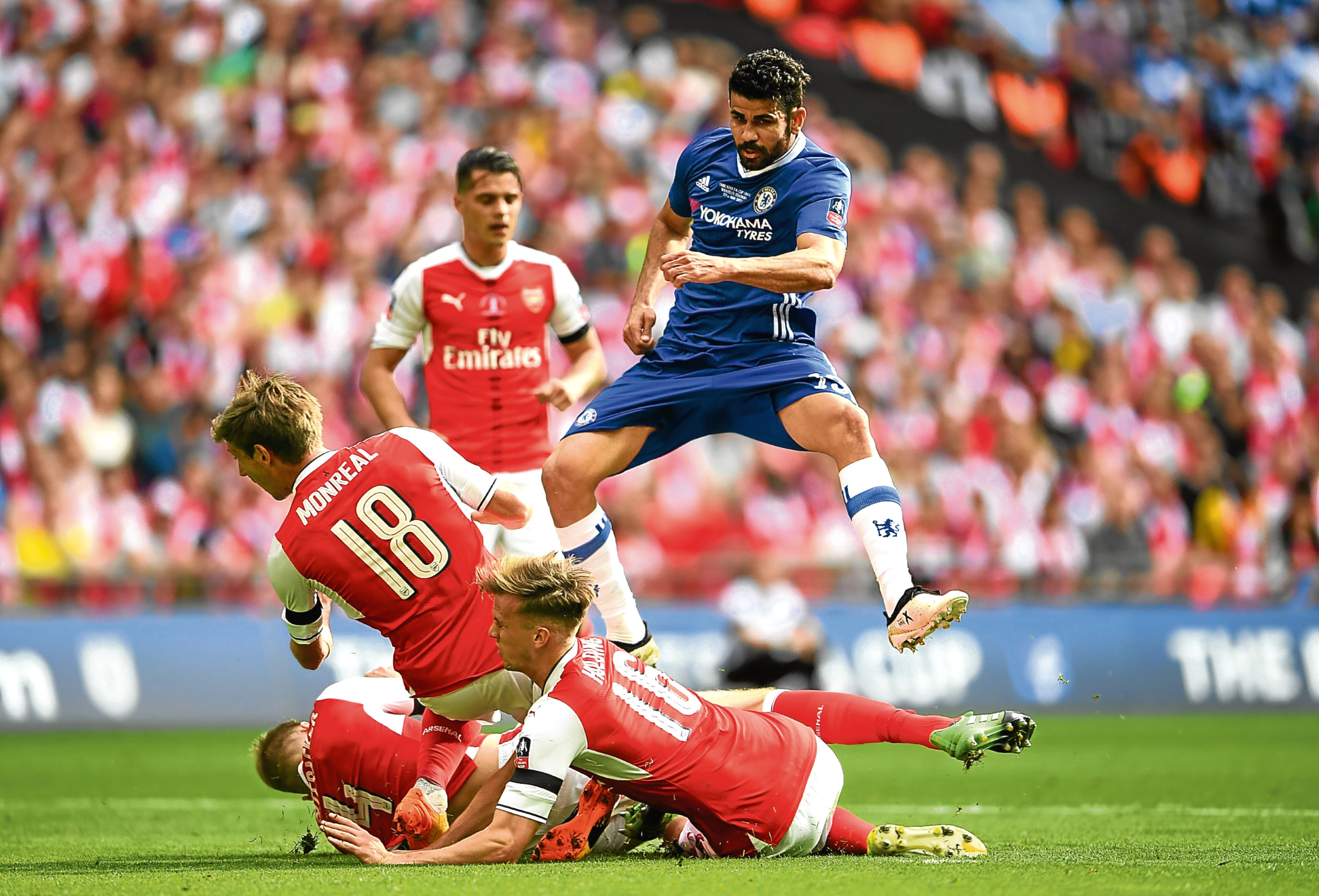 Diego Costa of Chelsea shoots as Nacho Monreal of Arsenal, Rob Holding of Arsenal attempt to block during The Emirates FA Cup Final between Arsenal and Chelsea at Wembley Stadium (Laurence Griffiths/Getty Images)