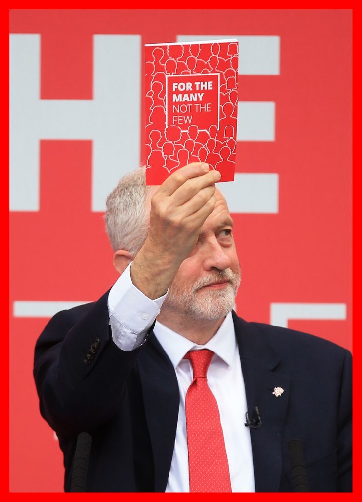Corbyn with his manifesto for the General Election (Danny Lawson/PA Wire)