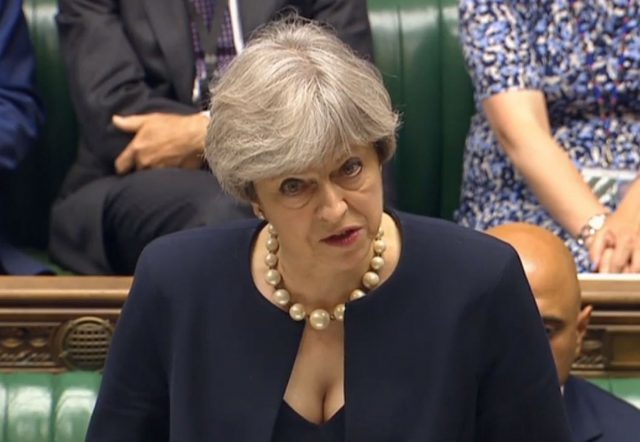 Theresa May has revealed tests on cladding on some tower blocks have revealed the material to be combustible (PA/PA Wire)