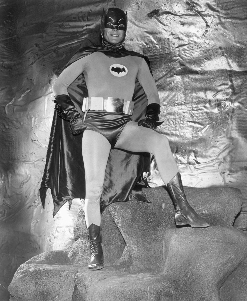 Actor Adam West wears his Batman costume in the Batcave in a full-length promotional portrait for the television series, 'Batman'. (Hulton Archive/Getty Images)