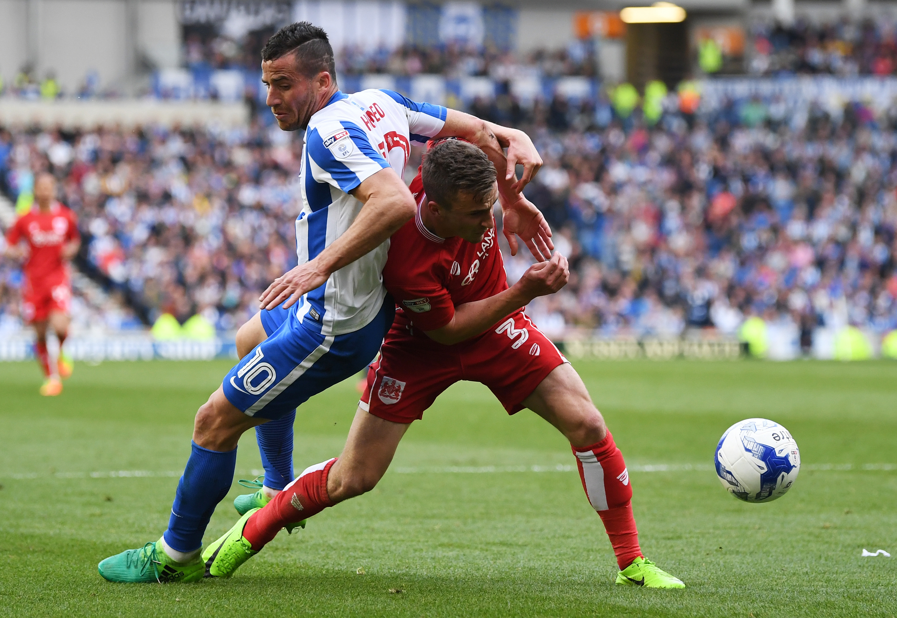 Tomer Hemed of Brighton and Hove Albion goes to ground after a challenge by Joe Bryan of Bristol City (Mike Hewitt/Getty Images)