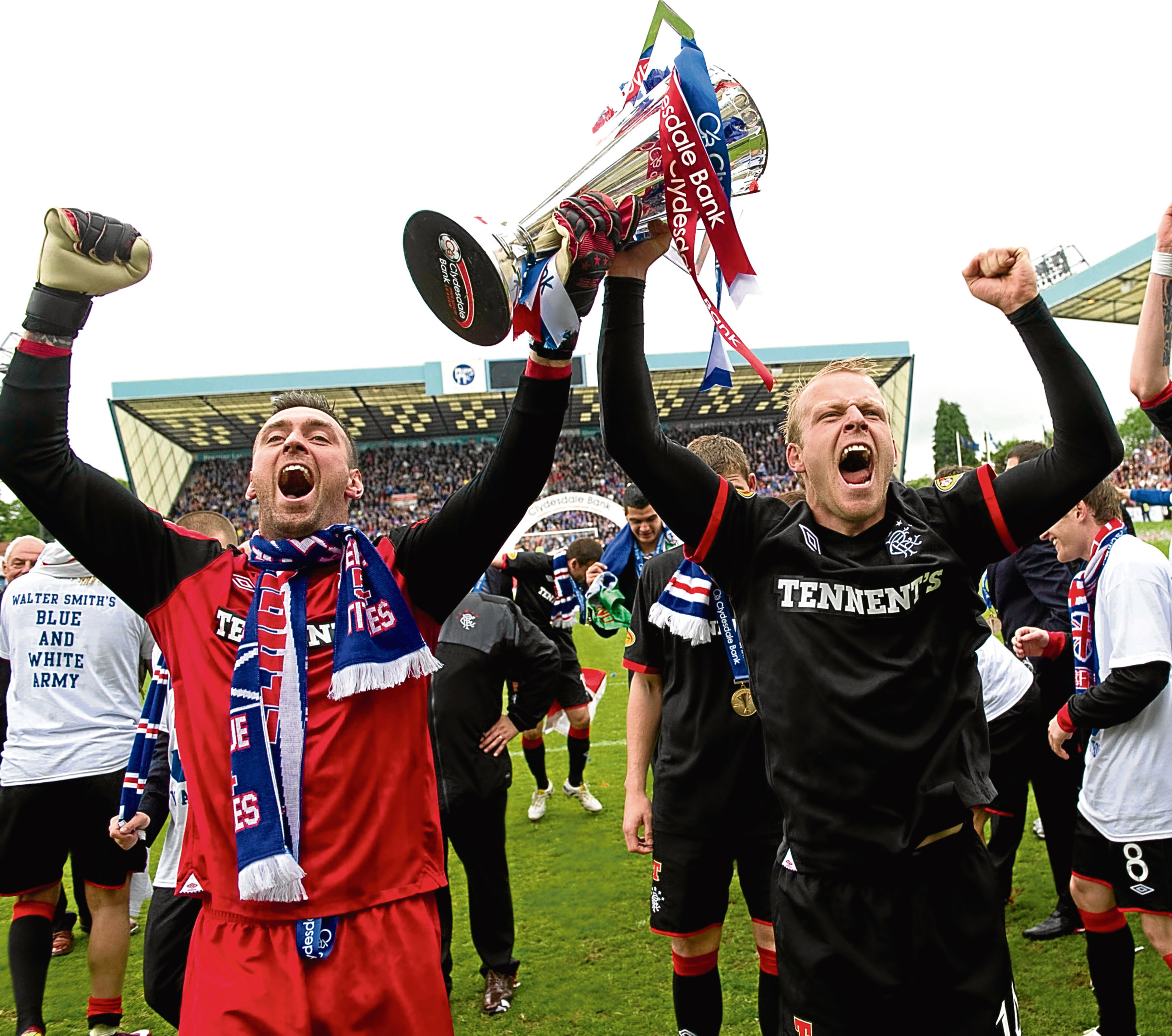 Rangers pair Allan McGregor (left) and Steven Naismith celebrate with the Clydesdale Bank Premier League trophy (SNS)