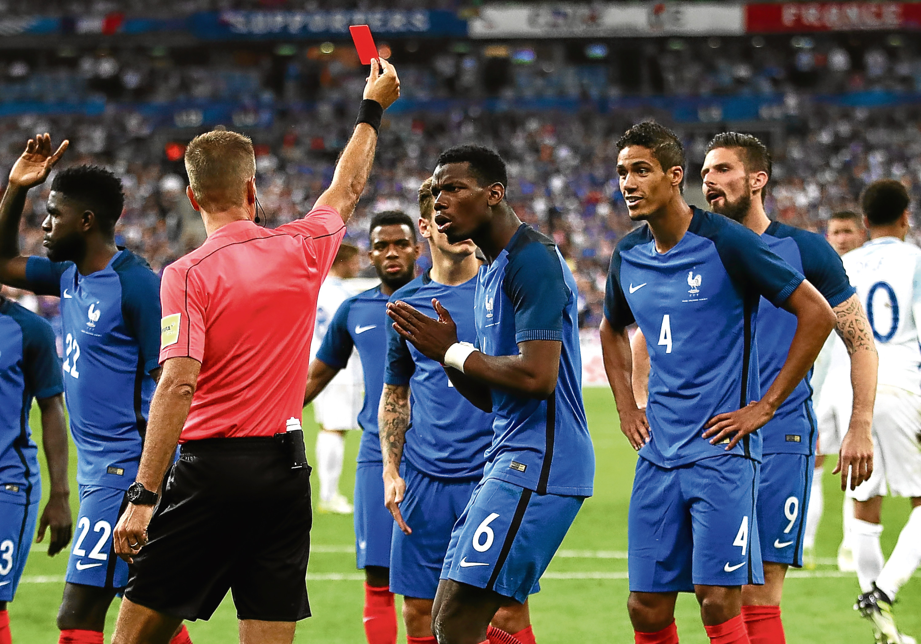 Paul Pogba reacts as Raphael Varane is shown the red card in the Stade de France (Julian Finney / Getty Images)