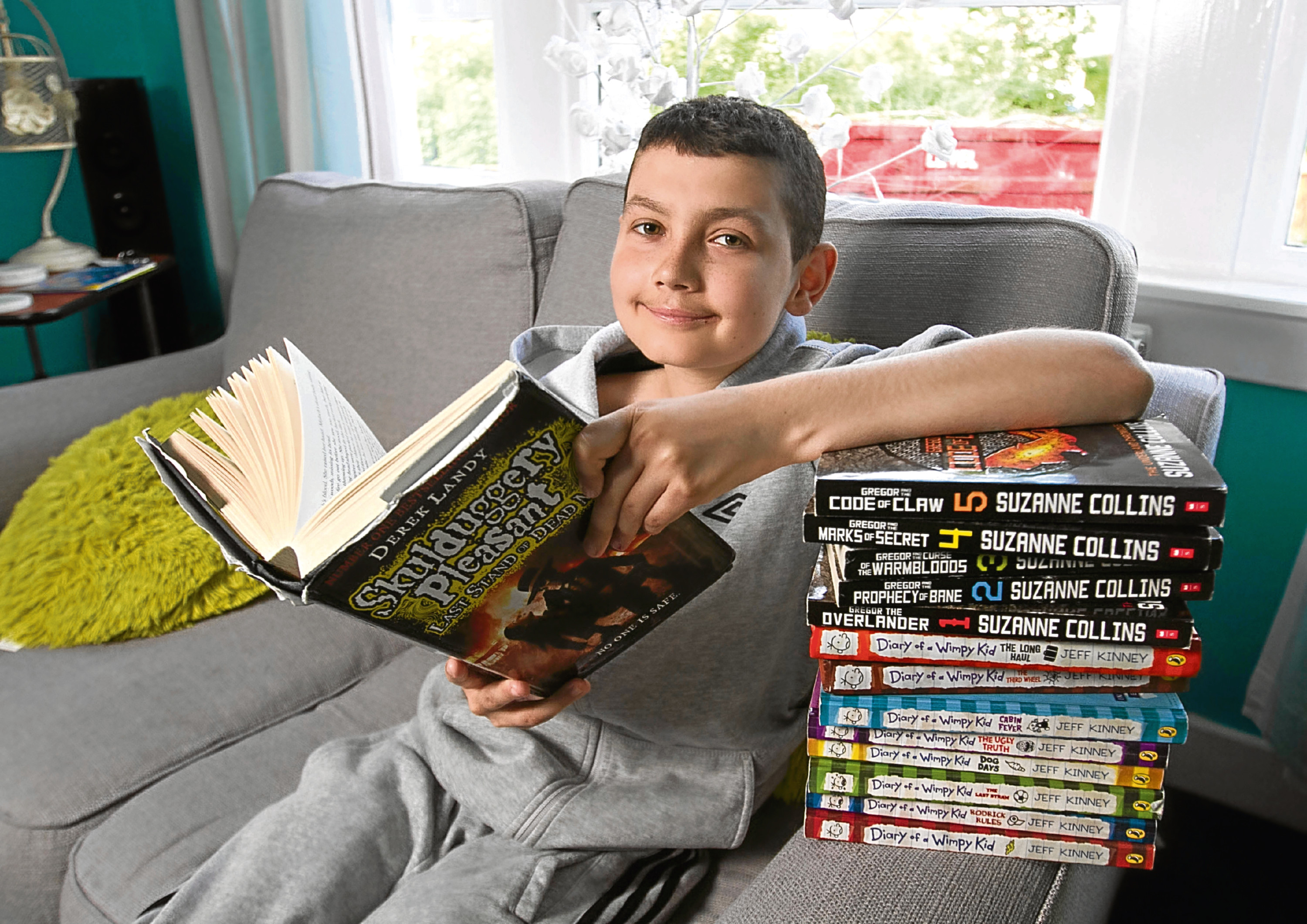 Declan Rennie, 14, spent only three days at St Mungo's High in Falkirk because of a cancer battle - but still came top in English (Sunday Post)