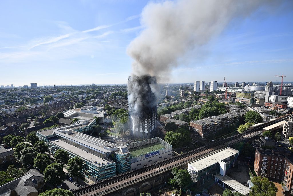 Smoke rises from the building after a huge fire engulfed the 24 story Grenfell Tower (Leon Neal/Getty Images)