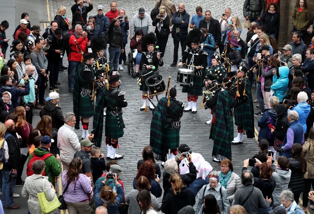 The Balaklava Pipes and Drums play to the crowds after they marched down the Royal Mile during the ninth annual Armed Forces Day in Edinburgh. (Andrew Milligan/PA Wire)