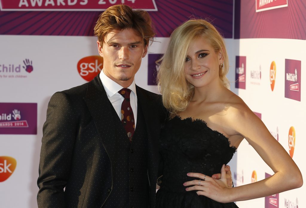 Pixie Lott (right) and her partner Oliver Cheshire (PA)