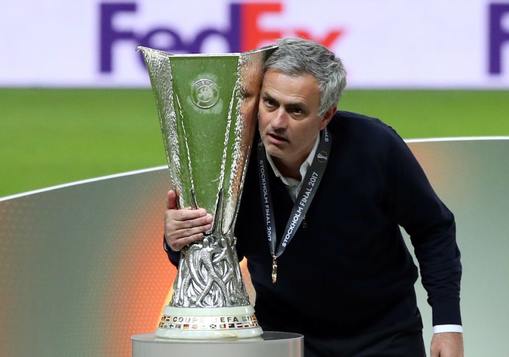 Manchester United manager Jose Mourinho poses with the Europa League trophy (Nick Potts / PA Wire)