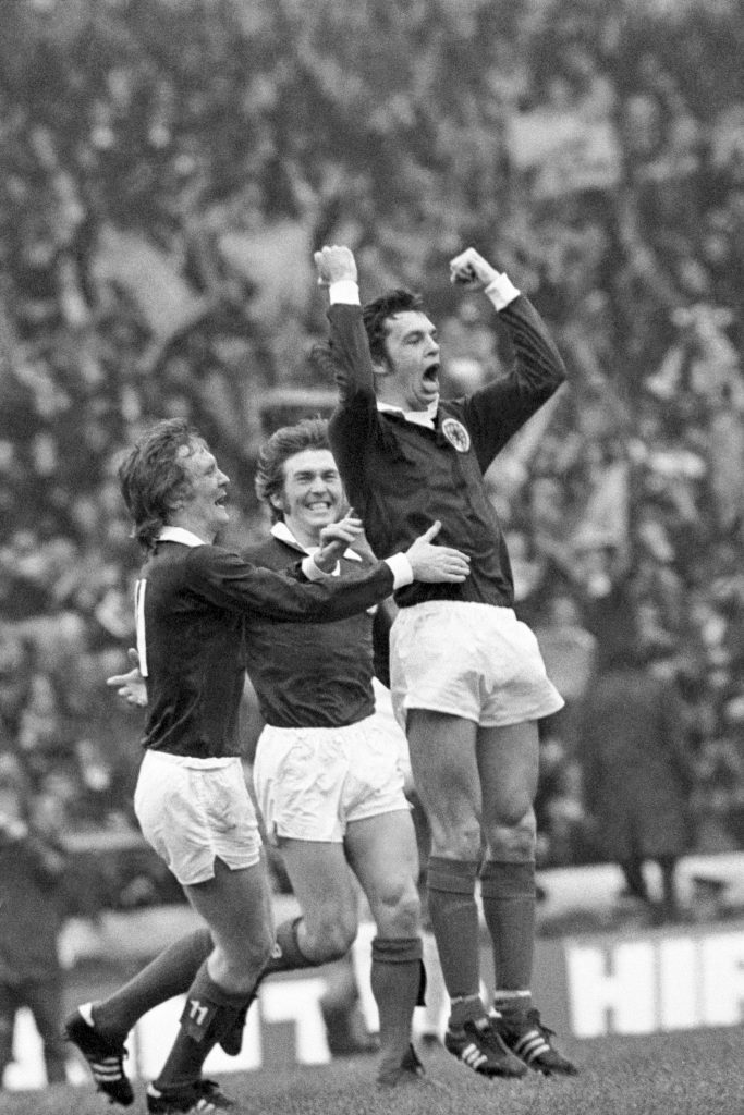Kenny celebrates the opening goal in 1974 win with Davie Hay and Joe Jordan (PA Archive)