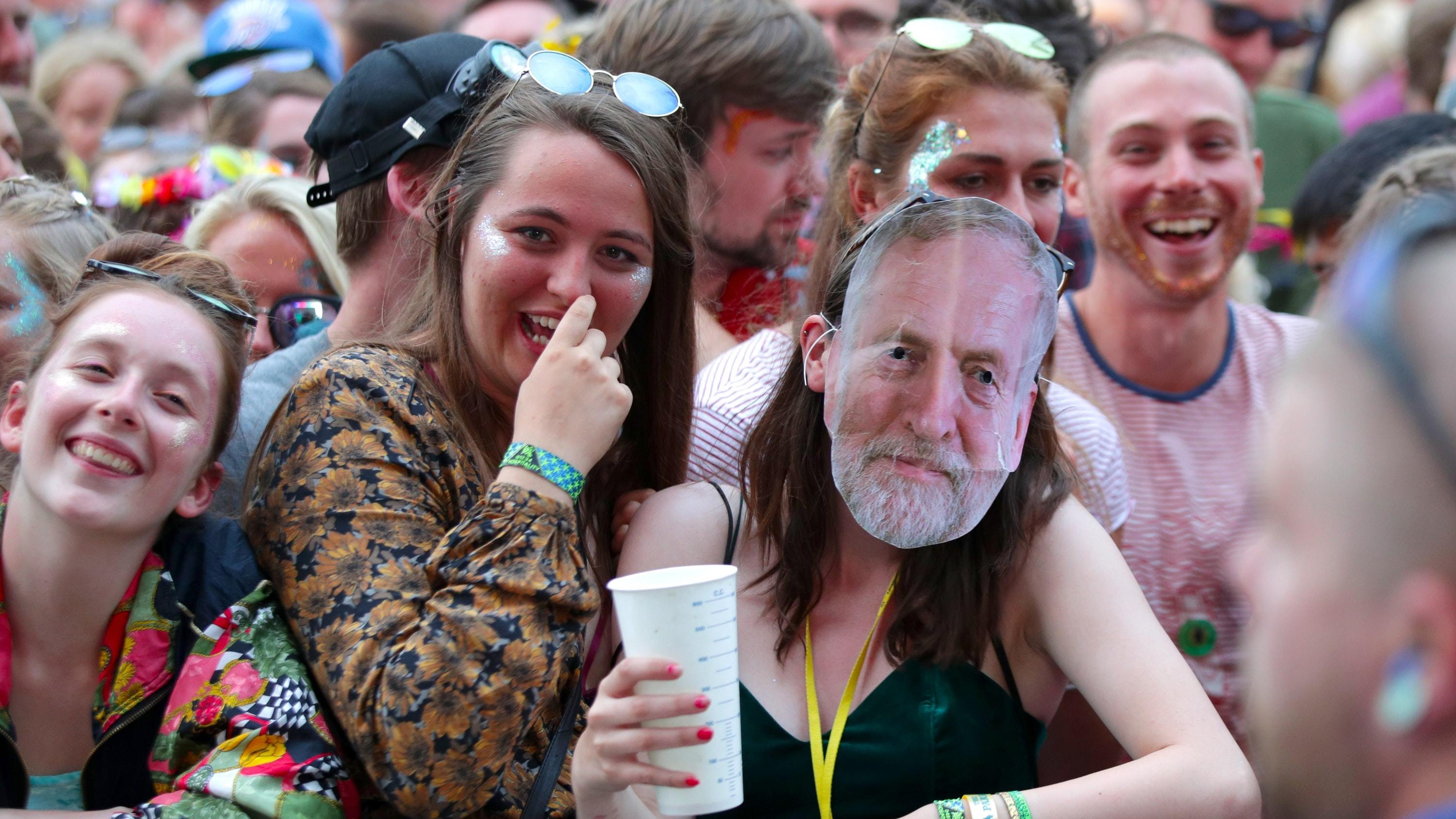 A festivalgoer wearing a Jeremy Corbyn mask at Glastonbury (Yui Mok/PA)