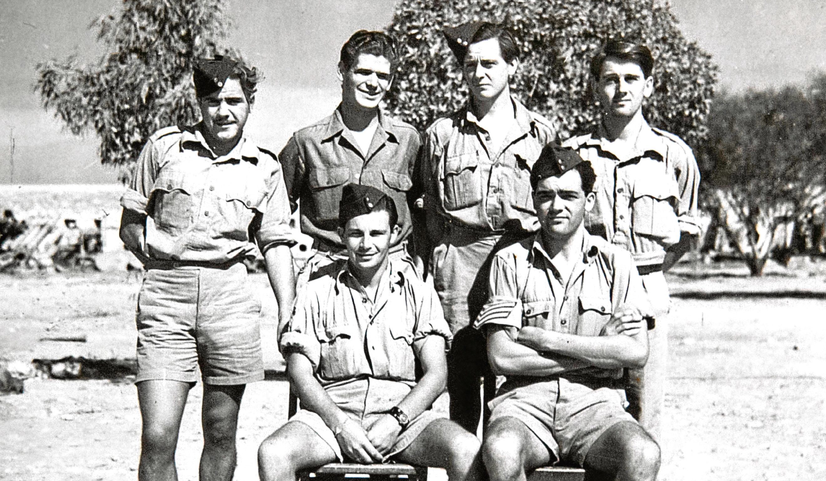 Reader Jane's uncle John (far left) and sole survivor Jim (right)