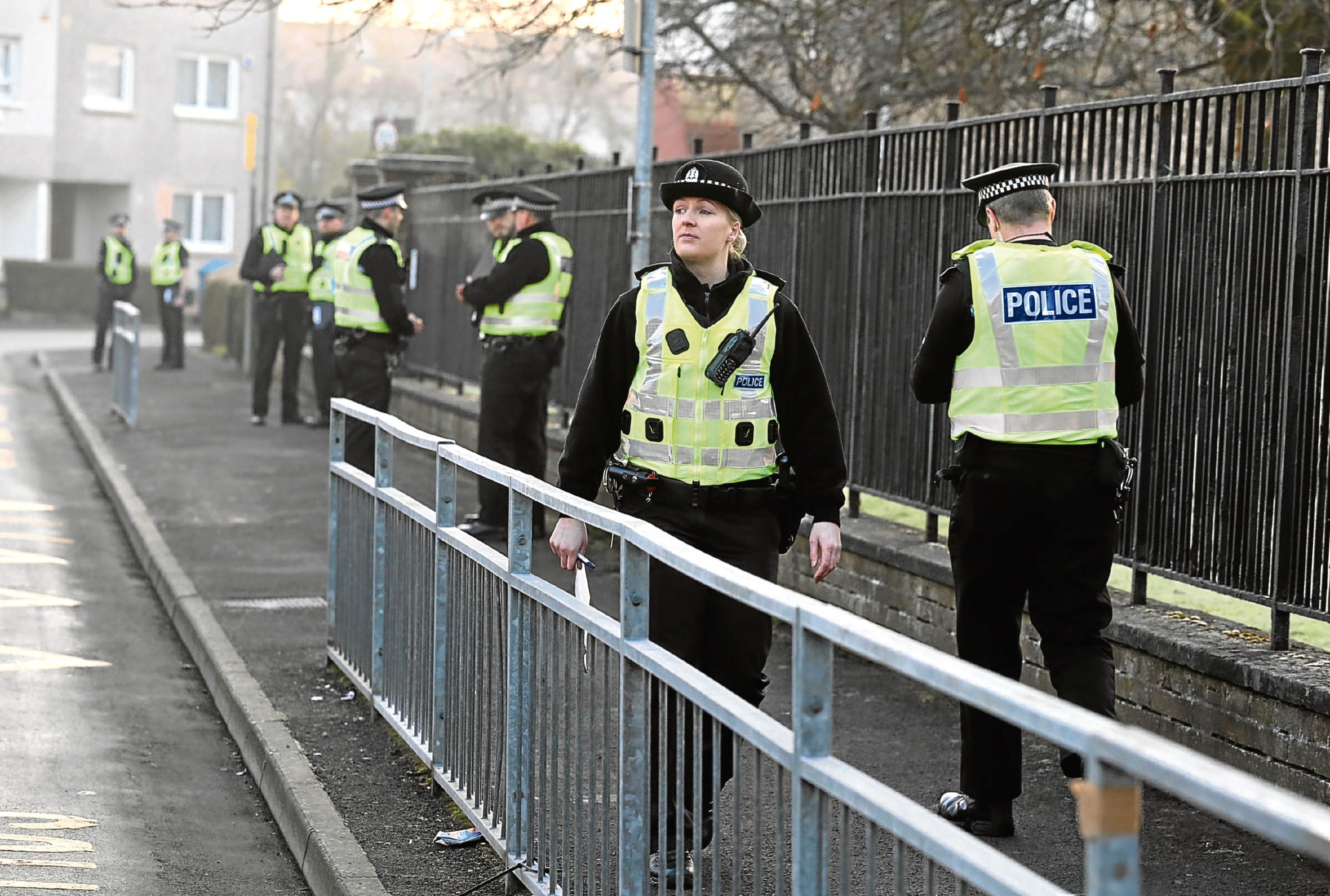 Police officers investigating an attempted murder near St George's Primary School in Penilee, Glasgow, January 2017 (Andrew Milligan/PA Wire)