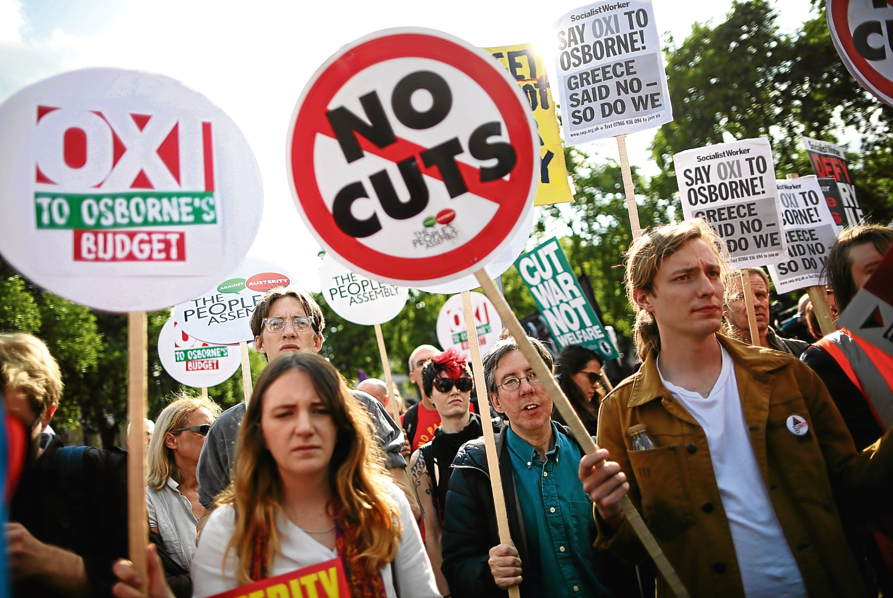 Protestors are seen outside the Houses of Parliament after the Chancellor of the Exchequer George Osborne delivered his Budget to the House on July 8, 2015 in London, (Dan Kitwood/Getty Images)