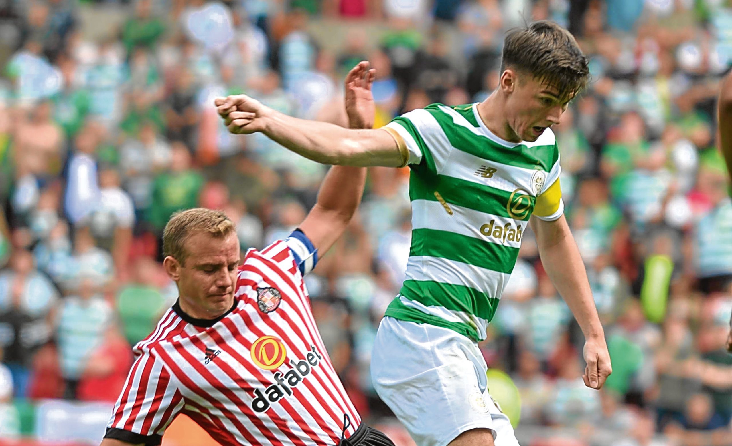 Kieran Tierney of Celtic is tackled by Lee Cattermole of Sunderland (Paul Vicente)