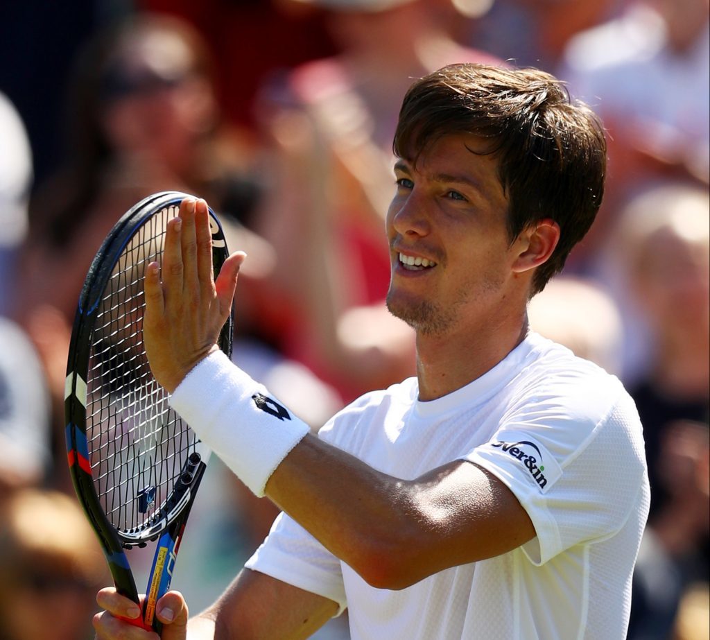 Aljaz Bedene of Great Britain acknowledges the crowd as he celebrates victory after the Gentlemen's Singles second round match against Damir Dzumhur of Bosnia and Herzegovinia on day three of Wimbledon (Michael Steele/Getty Images)