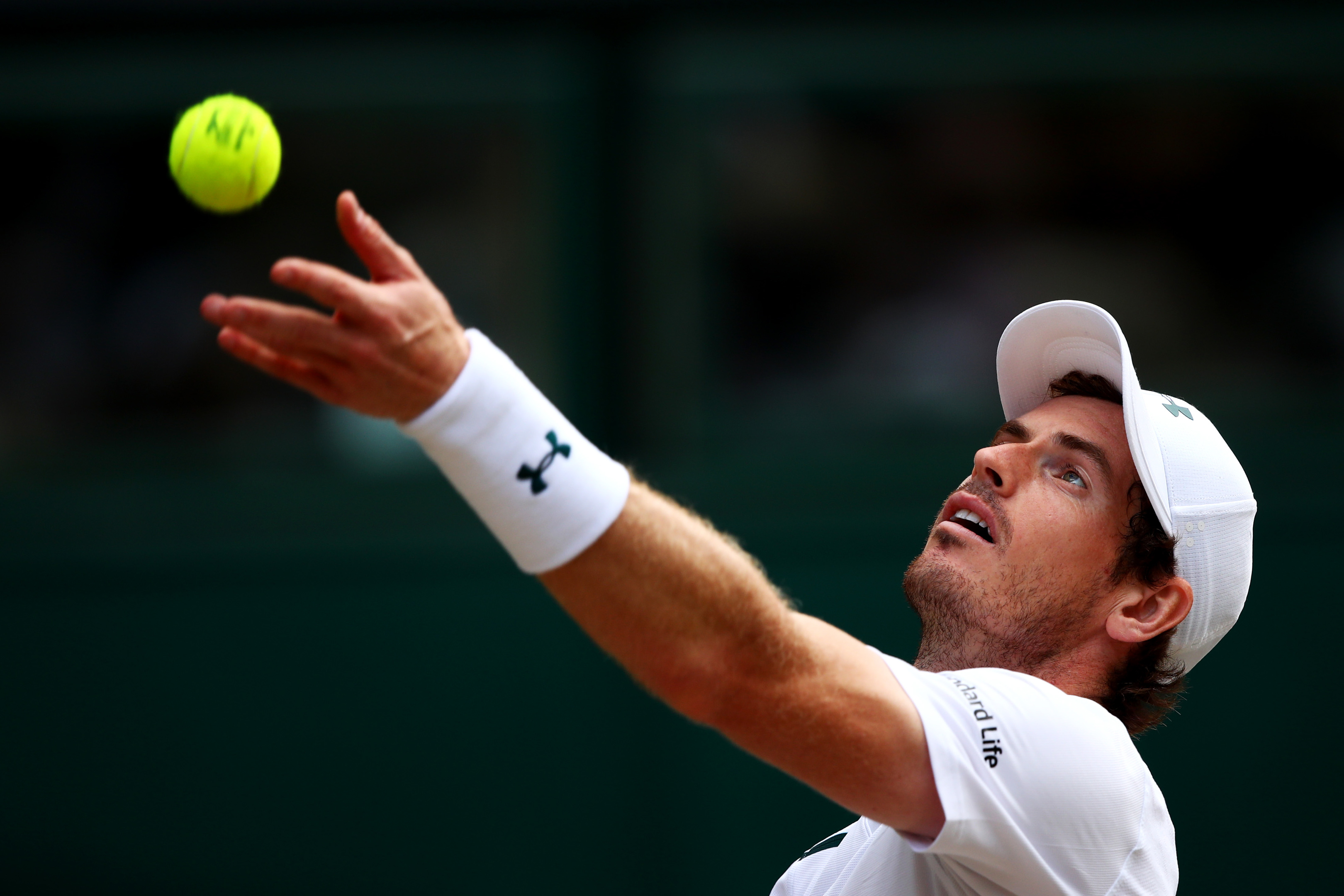 Andy Murray of Great Britain serves during the Gentlemen's Singles quarter final match against Sam Querrey of The United States on day nine of Wimbledon   (Clive Brunskill/Getty Images)