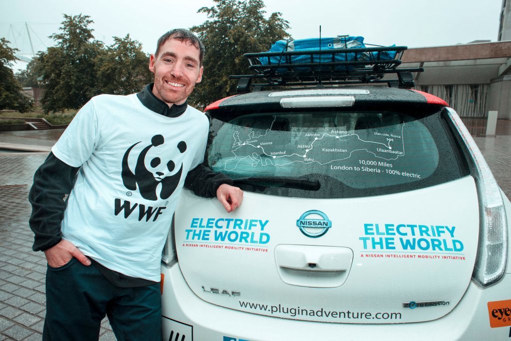 Chris Ramsey, from Aberdeenshire, next to his Nissan Leaf (MAVERICK PHOTO AGENCY/PA Wire)