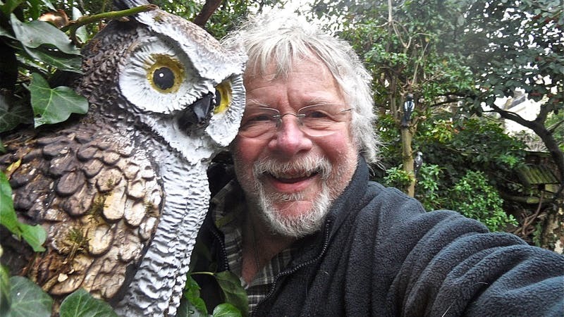 Birdwatcher Bill Oddie gives Hannah Stephenson a tour of his garden full of weird and wacky memorabilia (PA)