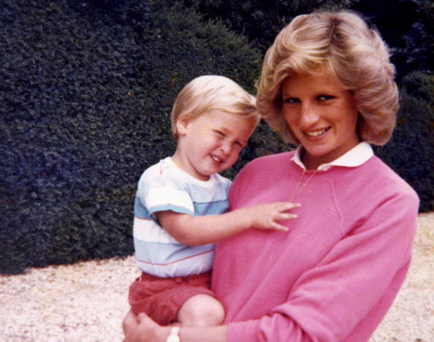 Photograph released by Kensington Palace, from the personal photo album of the late Diana, Princess of Wales, shows the princess holding Prince William whilst pregnant with Prince Harry, and features in the new ITV documentary 'Diana, Our Mother: Her Life and Legacy', which airs on ITV at 21.00hrs on Monday 24th July. (The Duke of Cambridge and Prince Harry)