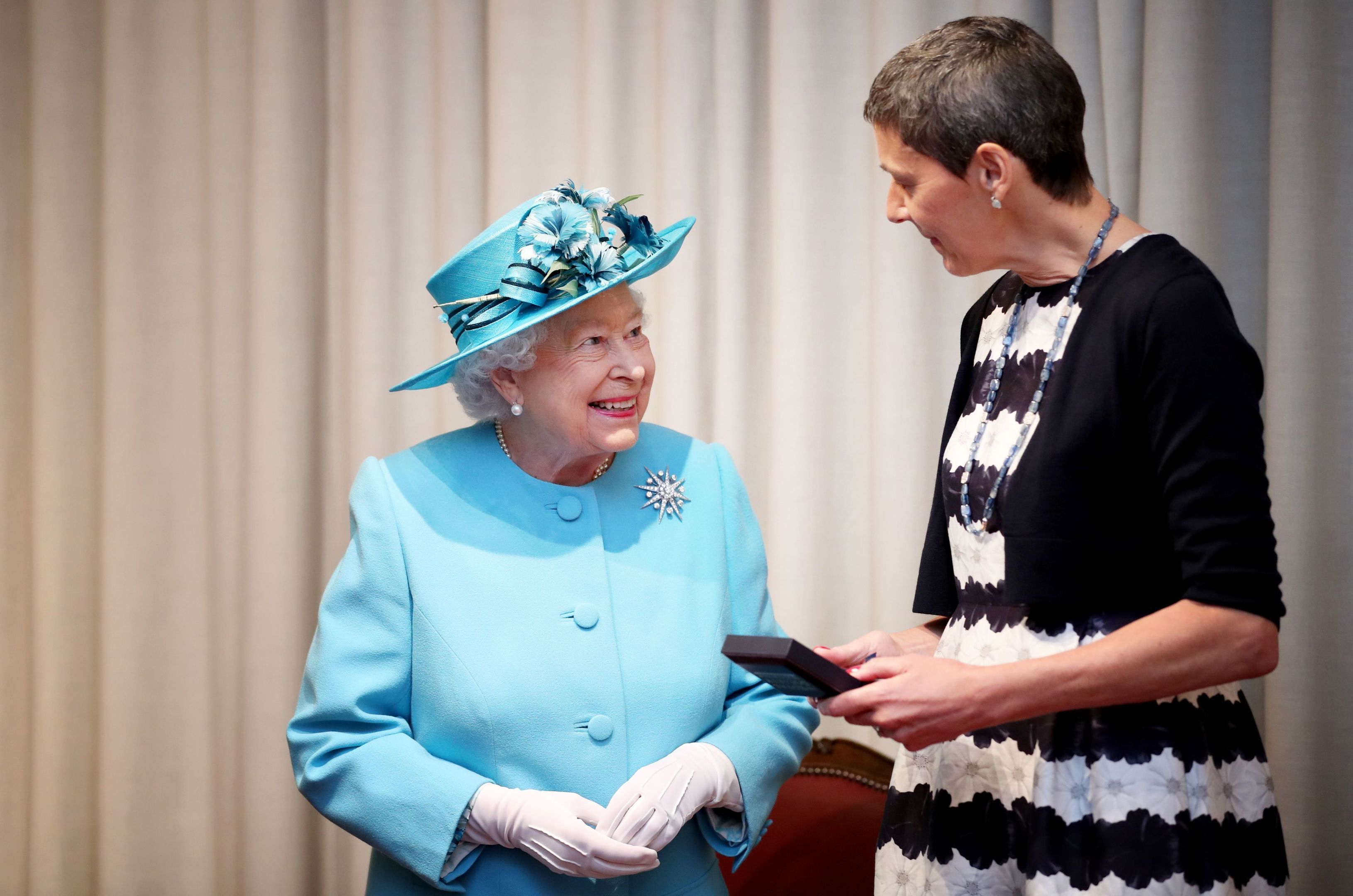 Queen Elizabeth II presents the Royal Medal to Professor Tessa Holyoake during a visit to the Royal Society of Edinburgh (Jane Barlow/PA Wire)