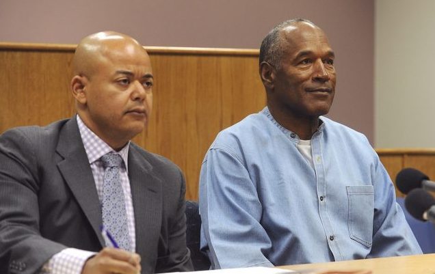 OJ Simpson appears with his attorney Malcolm LaVergne (left) via video for his parole hearing (Jason Bean/The Reno Gazette-Journal via AP)