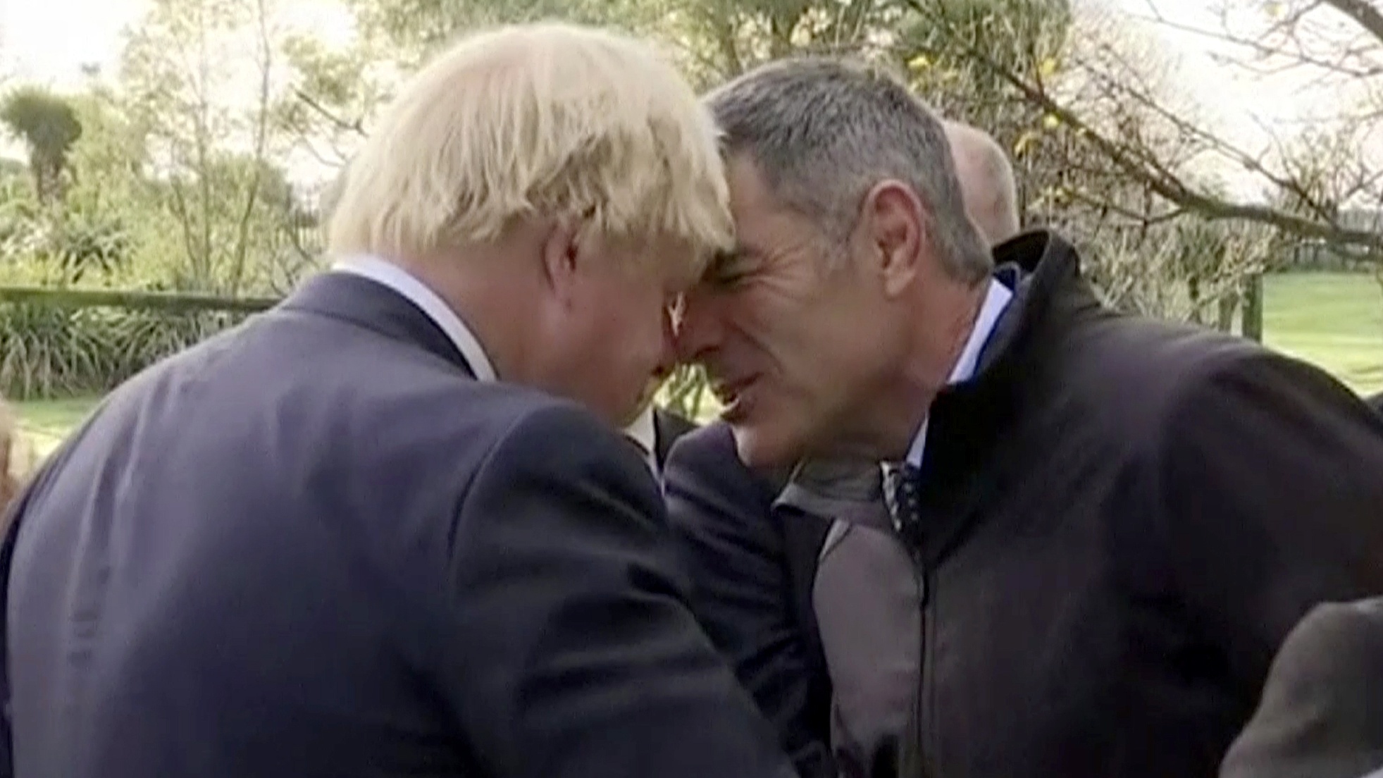 Boris Johnson performs a hongi welcome with a New Zealand MP (TVNZ via AP)