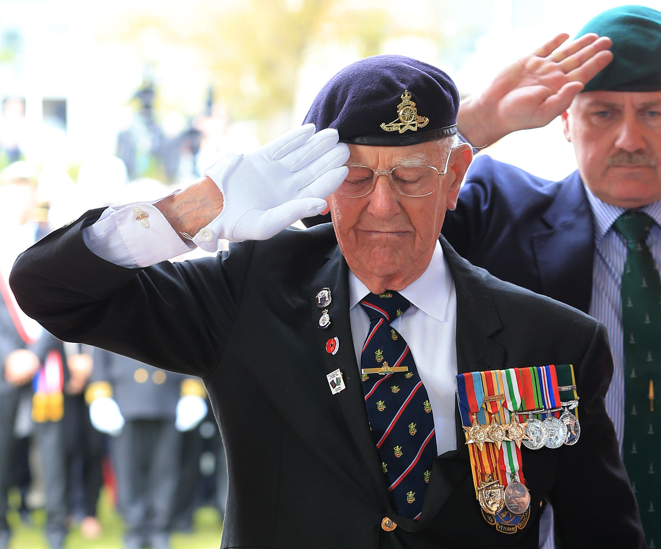 Dunkirk veteran Garth Wright (95) salutes after laying a wreath at the British Memorial in Dunkirk Military Cemetery, France, during a memorial service as part of the 75th anniversary commemorations of Operation Dynamo. (PA)