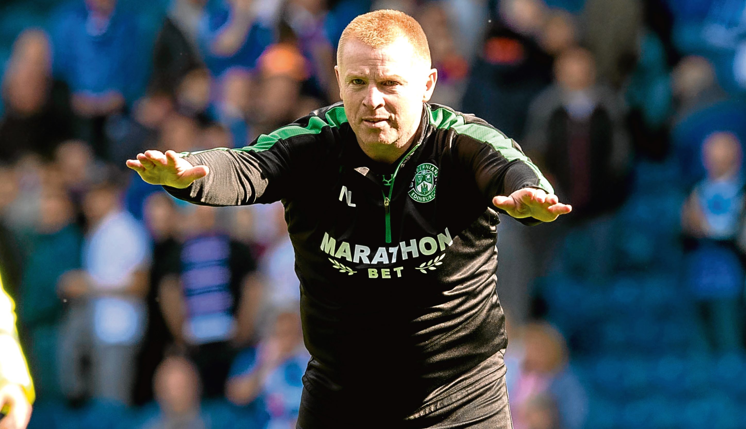 Hibernian head coach Neil Lennon celebrates at full time after the win over Rangers (SNS Group)