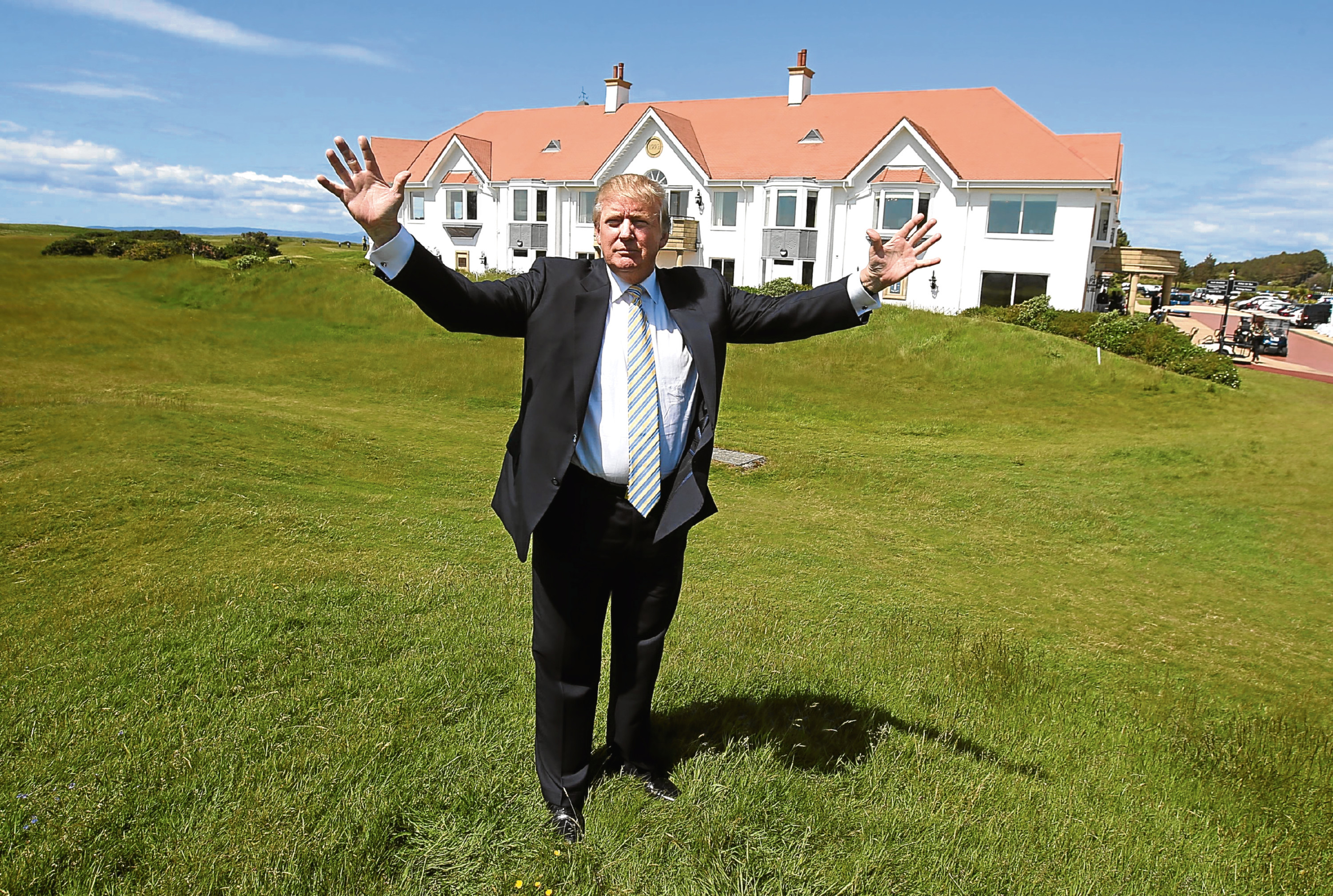 Donald Trump poses for a picture after unveiling the multi-million pound refurbishment of the Trump Turnberry clubhouse at his golf course in south Ayrshire.