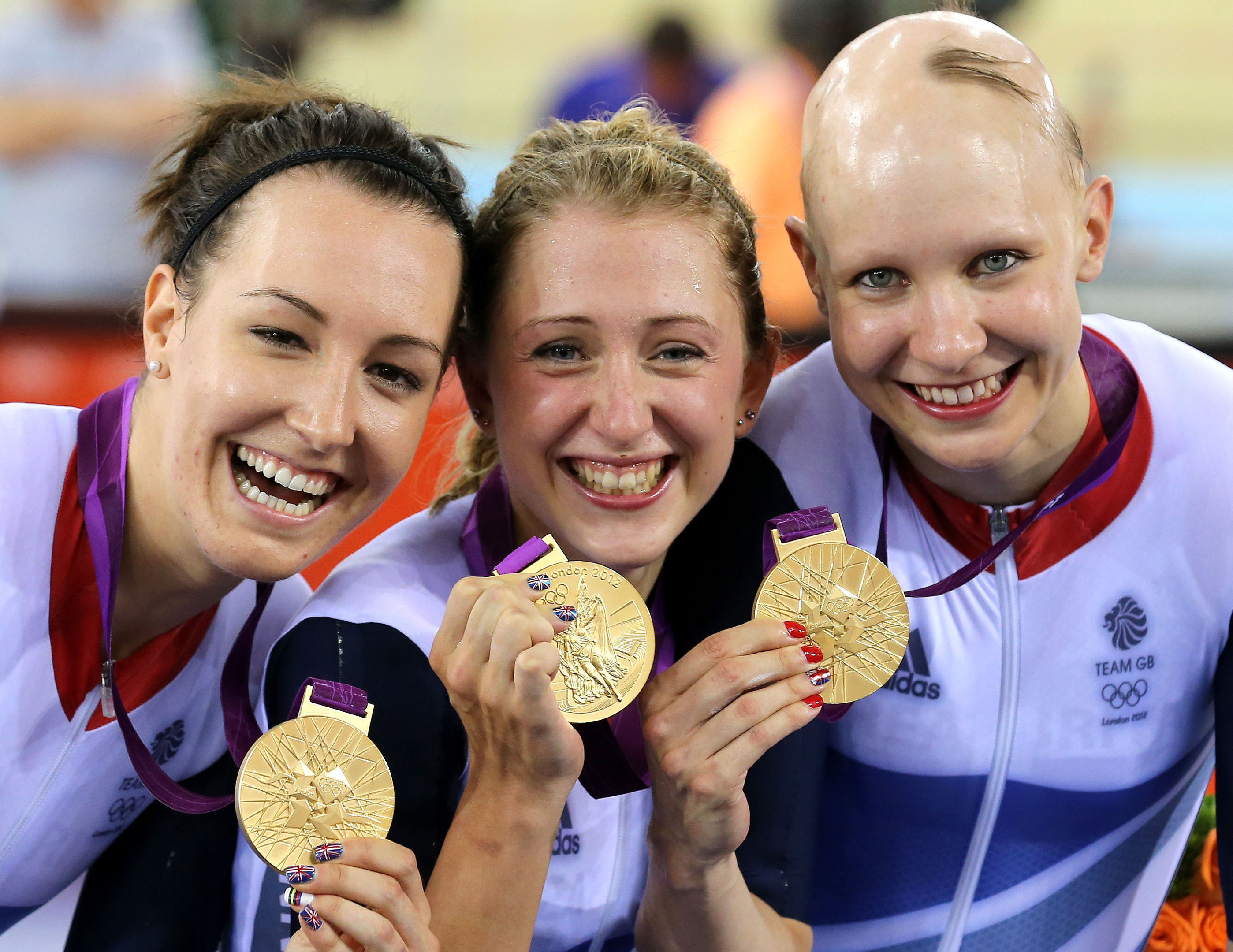 Great Britain's (left to right) Dani King, Laura Trott and Joanna Rowsell celebrate with their gold medals (Andrew Milligan/PA Wire.)