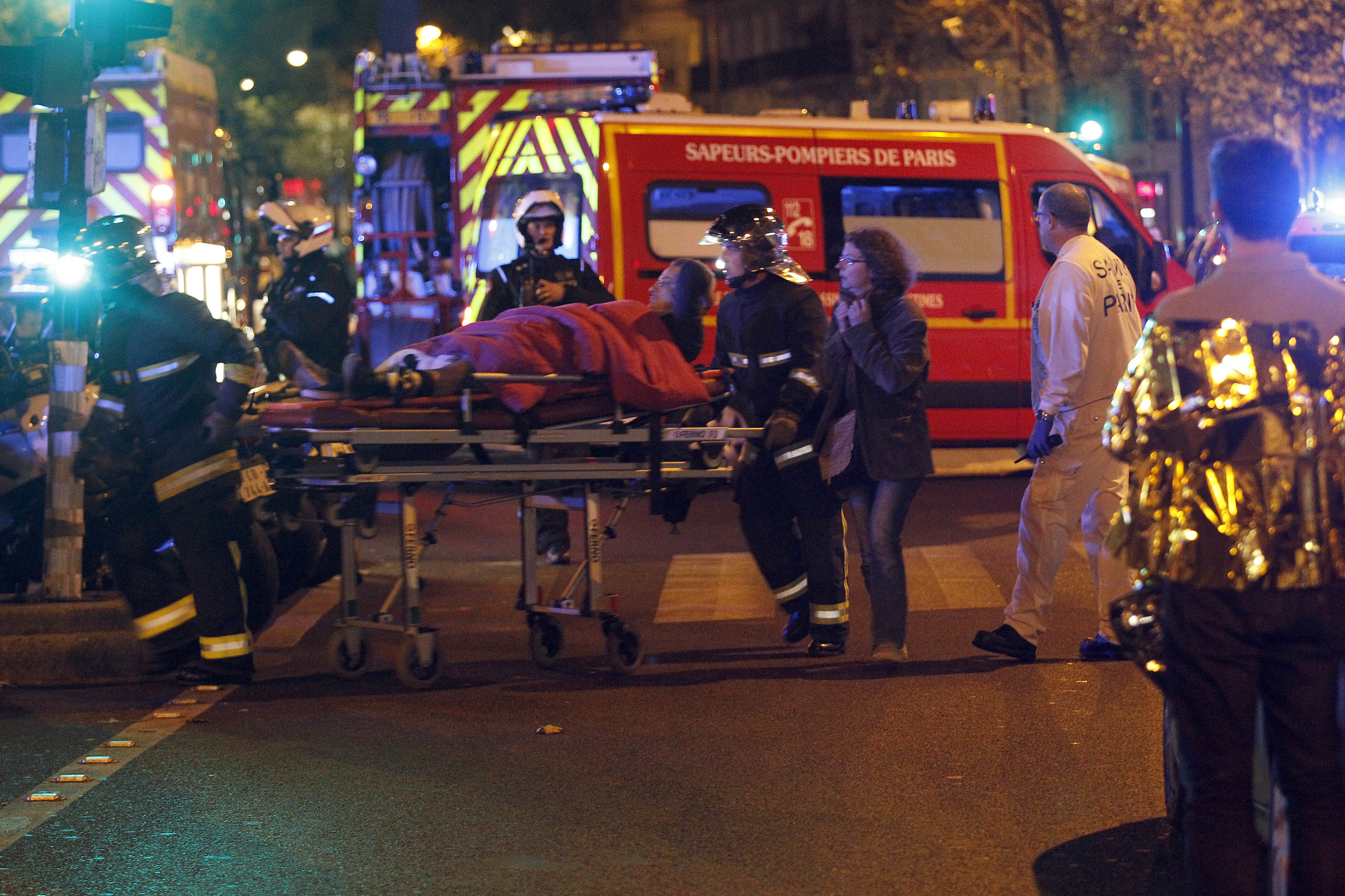 Medics move a wounded man near the Boulevard des Filles-du-Calvaire after an attack November 13, 2013 in Paris, France. (Thierry Chesnot/Getty Images)