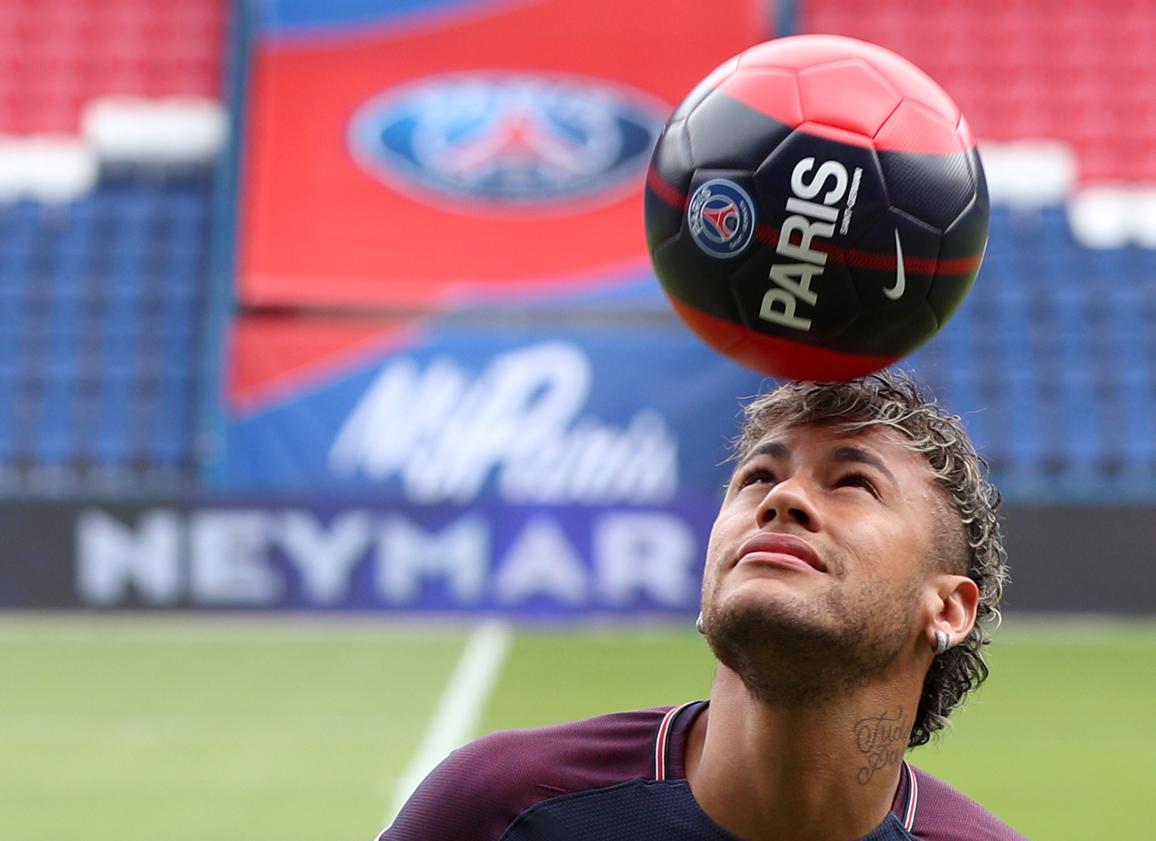 Neymar performs skills pitchside after a press conference at the Parc des Princes (PA)