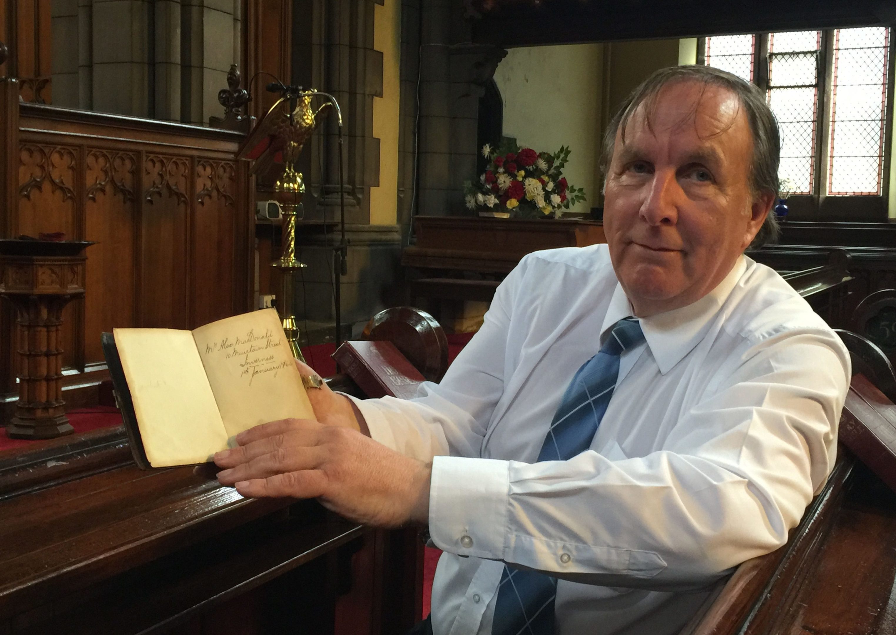 Donald Mackechnie, with a 151-year-old Bible which has been returned to the Scots descendants of its original owner (The Church of Scotland/PA Wire)