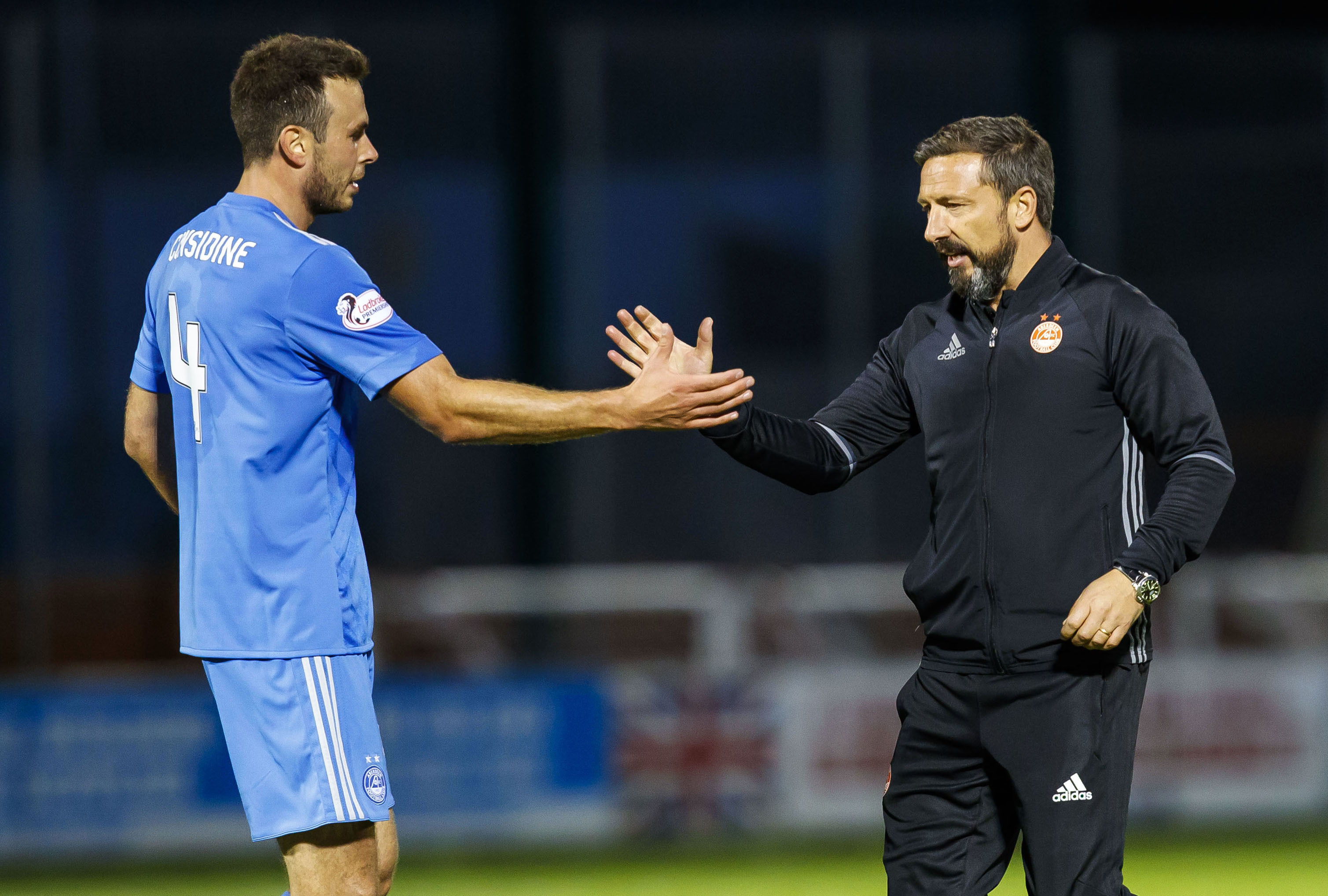 Aberdeen's Andrew Considine (left) celebrates with his manager Derek McInnes at full time (SNS Group / Roddy Scott)