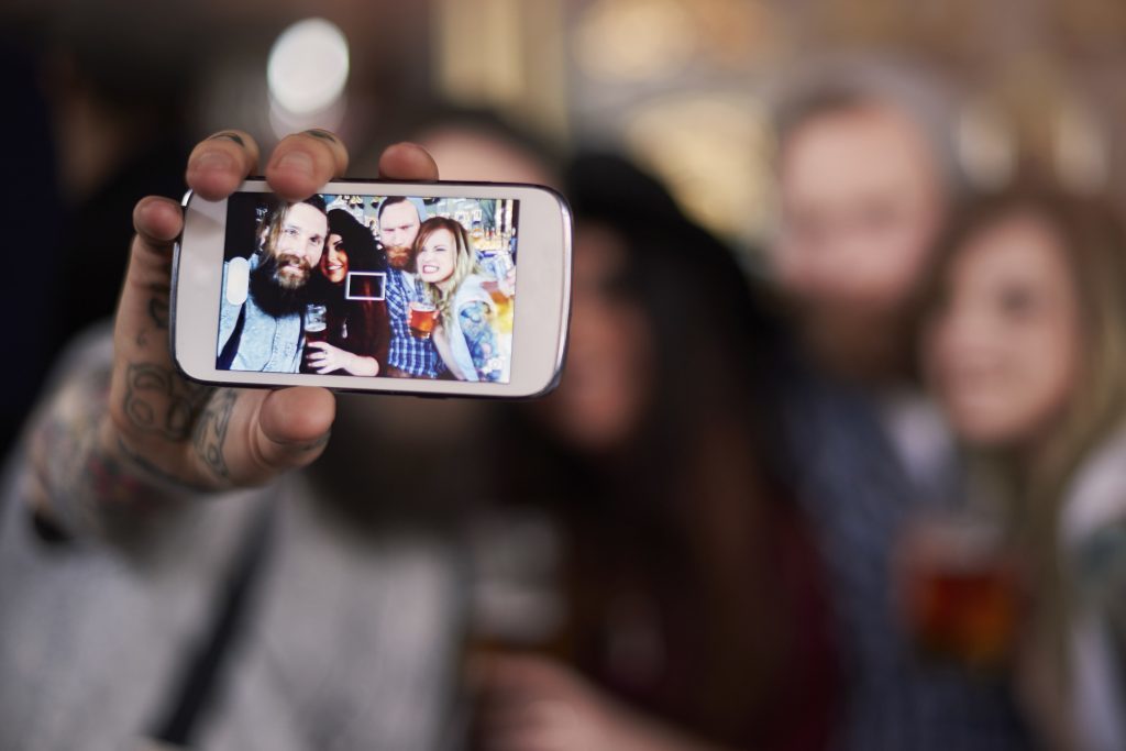 Social media users take an average of six selfies before selecting the best one to upload (iStock)