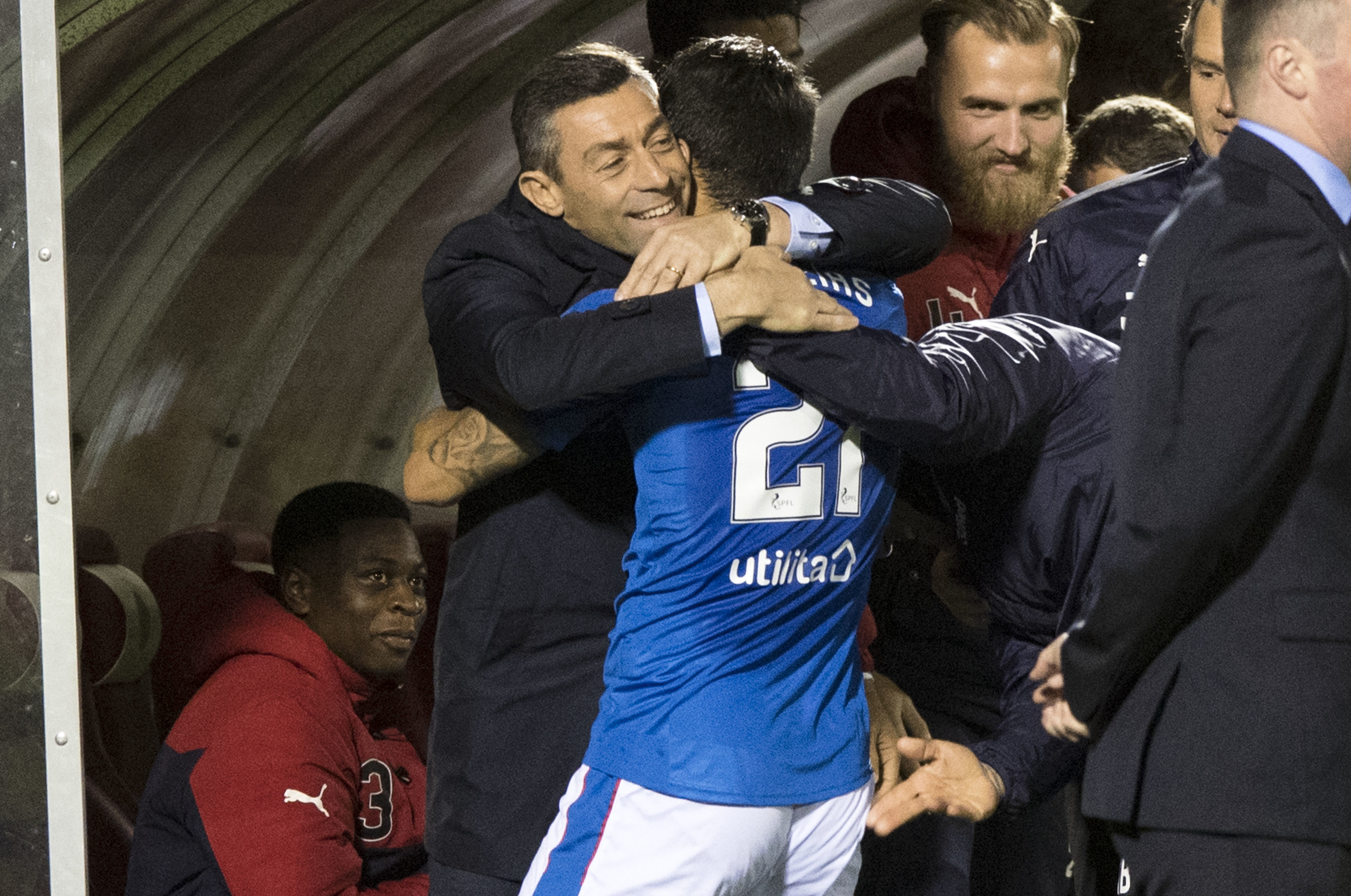 Rangers manager Pedro Caixinha (left) celebrates with Daniel Candeias after scoring his side's third goal (SNS)