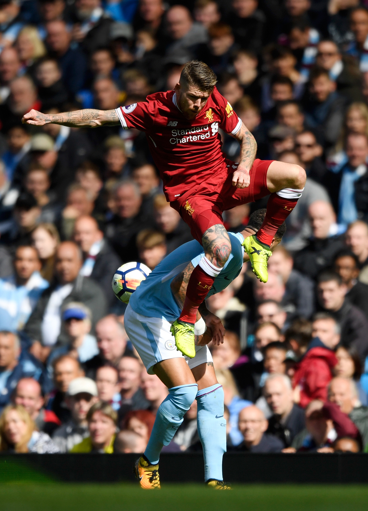 Alberto Moreno of Liverpool and Kyle Walker of Manchester City battle for possession (Stu Forster/Getty Images)