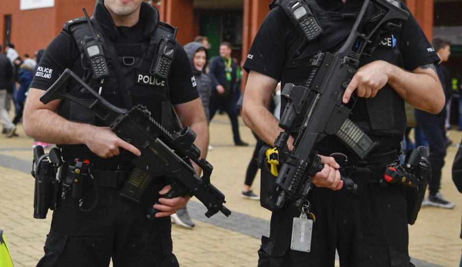 Armed Police patrol outside Celtic Park for a match earlier this season (SNS Group)