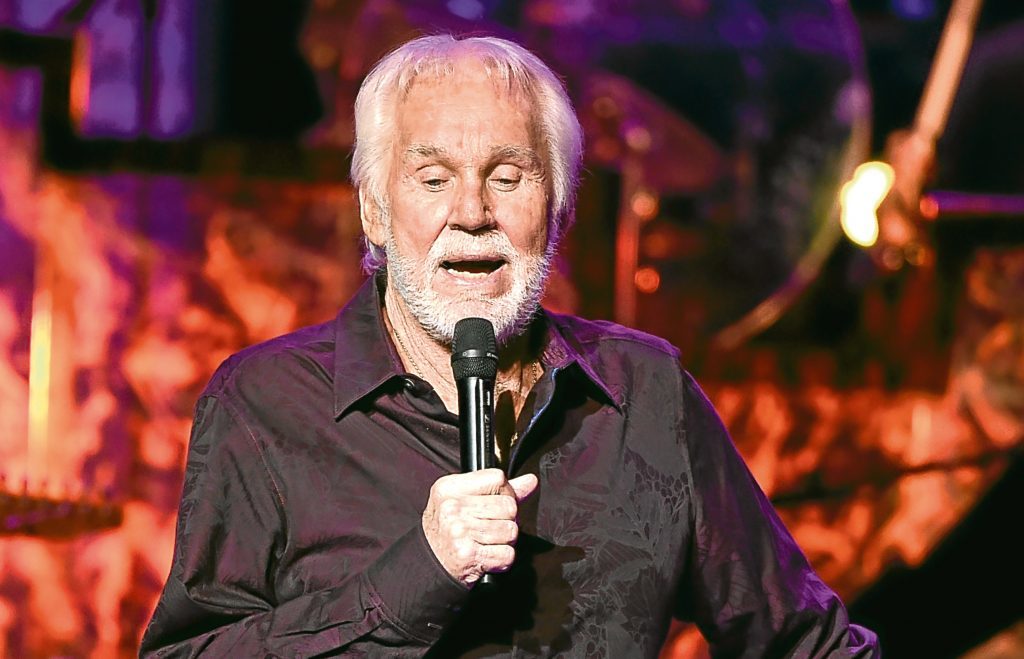 Kenny Rogers performs onstage during his final world tour "The Gambler's Last Deal" (Kevin Winter/Getty Images)