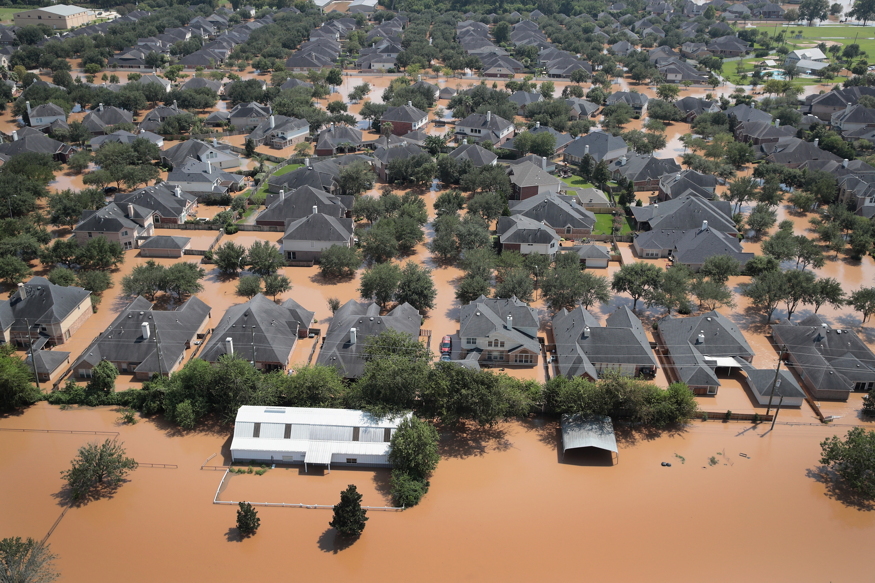 Homes are surrounded by floodwater after torrential rains pounded Southeast Texas following Hurricane and Tropical Storm Harvey  (Scott Olson/Getty Images)