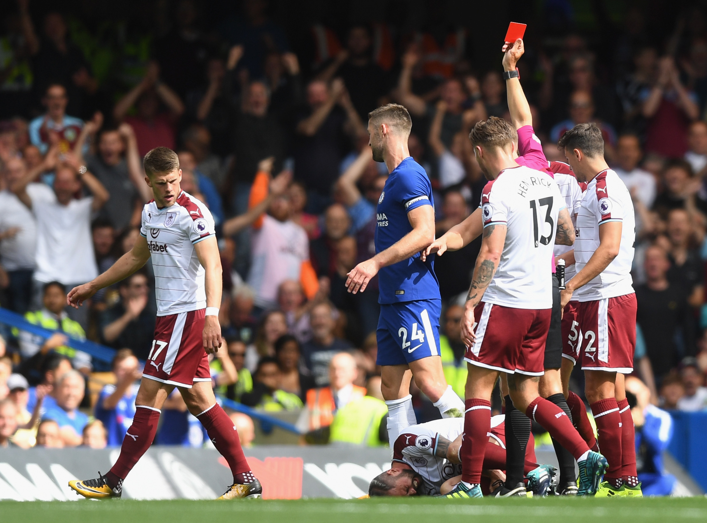 Gary Cahill of Chelsea is sent off by referee Craig Pawson after a challenge on Steven Defour of Southampton (Michael Regan/Getty Images)