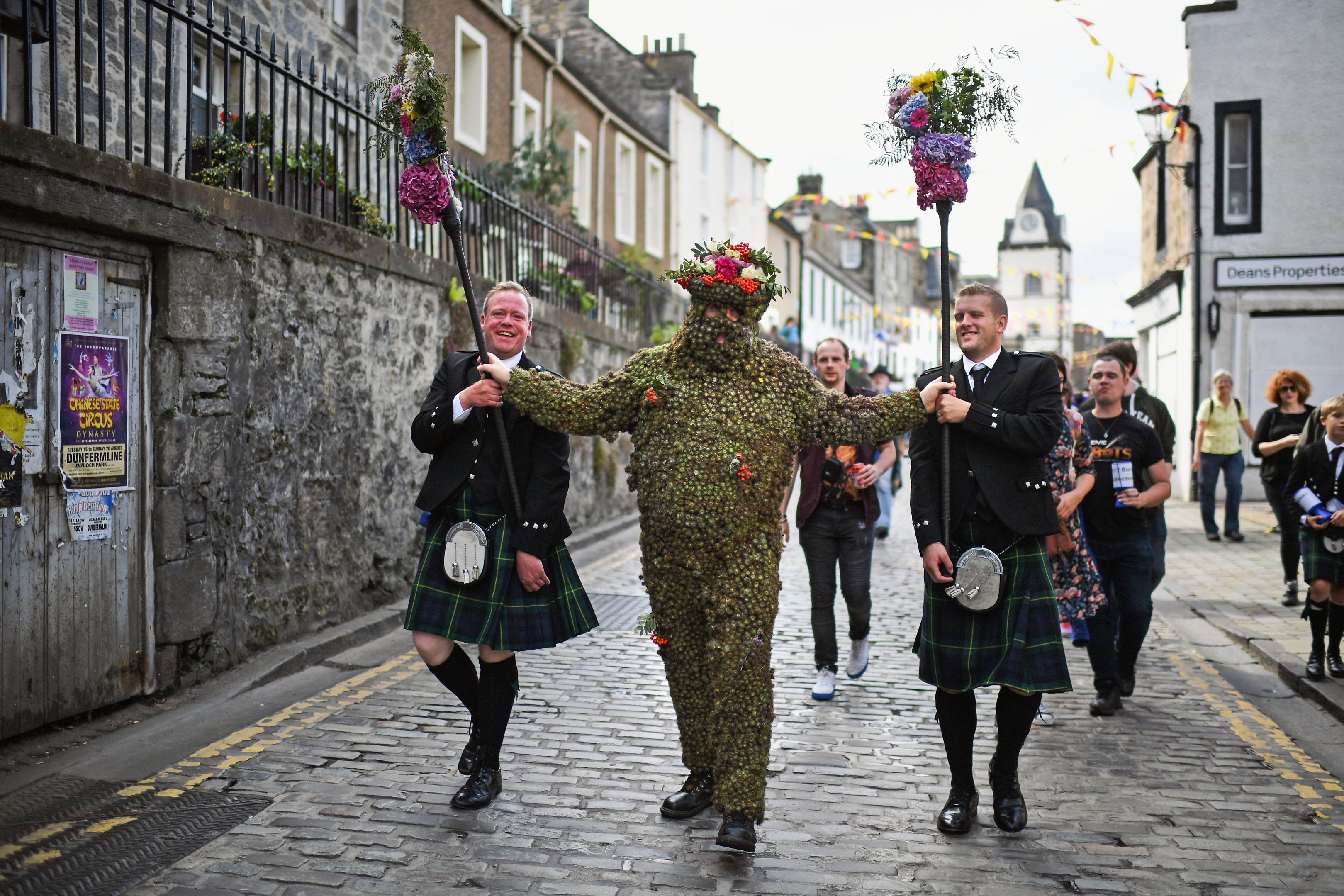 Burryman Andrew Taylor meets residents as he parades through the town in August (Jeff J Mitchell/Getty Images)